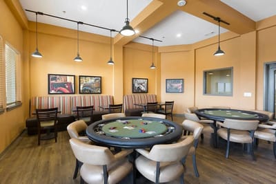 Interior view of a recreational room with poker tables