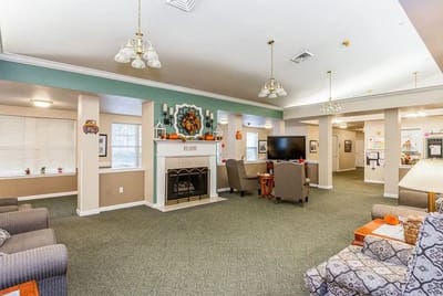 Common area with seating and decorations for fall