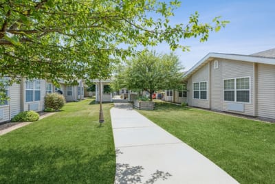 Pathway through landscaped outdoor area of the facility