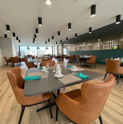 Dining room with modern decor and table settings