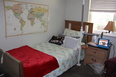 Cozy resident room with a world map on the wall