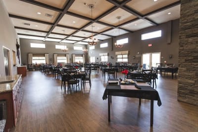 Spacious dining room with tables set for meals