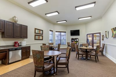 Interior view of a common area with tables and chairs