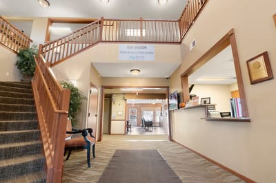 Interior view of the facility lobby area with seating and signage