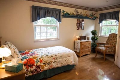Cozy private resident room with floral bedding