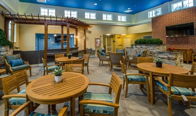 Interior common area with wooden tables and blue accents