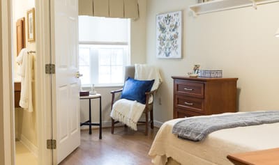 Cozy private resident room with a chair and decor