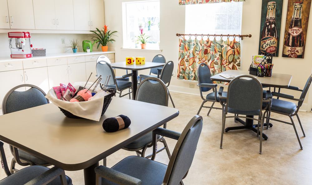 Bright common area with tables and chairs