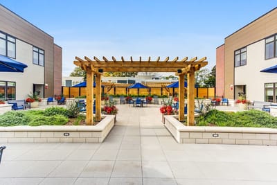 Outdoor patio area with seating and landscaping