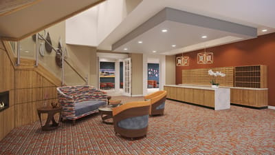 A modern interior lounge area with seating and decor