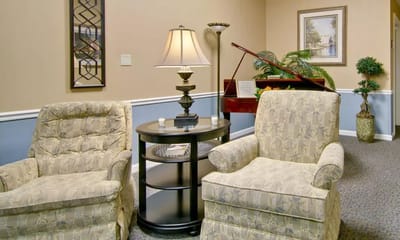 Comfortable seating in a common area with piano