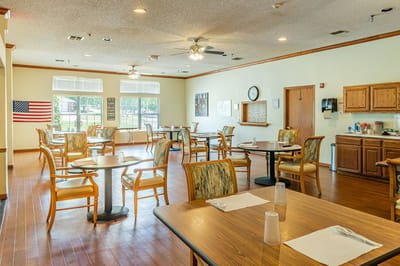 Bright dining area with tables and chairs