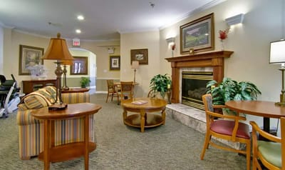 Bright common area with seating and fireplace