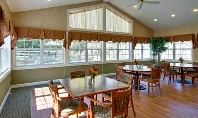 Bright dining room with tables and natural light