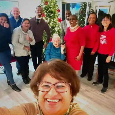 Staff and residents celebrating during a holiday event