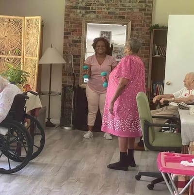 Residents engaging in an activity with staff