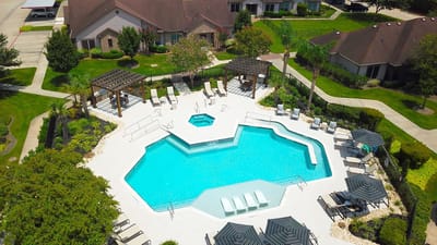 Aerial view of a swimming pool with seating area