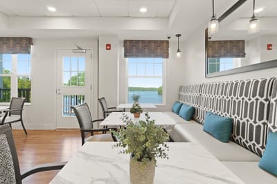 Bright dining area with a view of the water
