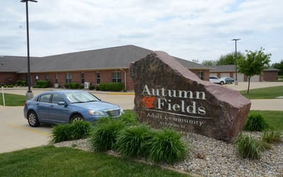 Exterior view of Autumn Fields Adult Community building and sign