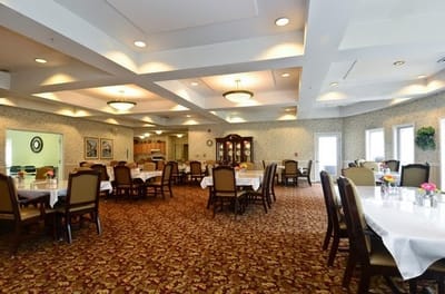 Elegant dining room with tables set for meals
