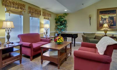 Cozy common area with seating and a piano