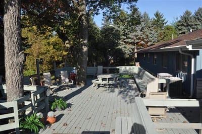 An outdoor patio area with seating and greenery