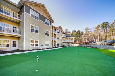 Exterior view of Azalea Estates with putting green