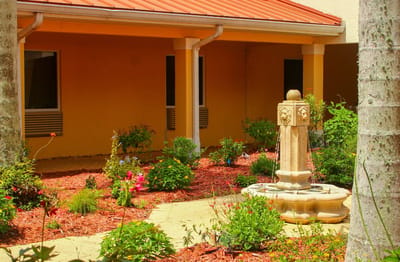 Garden area with a fountain and flowering plants