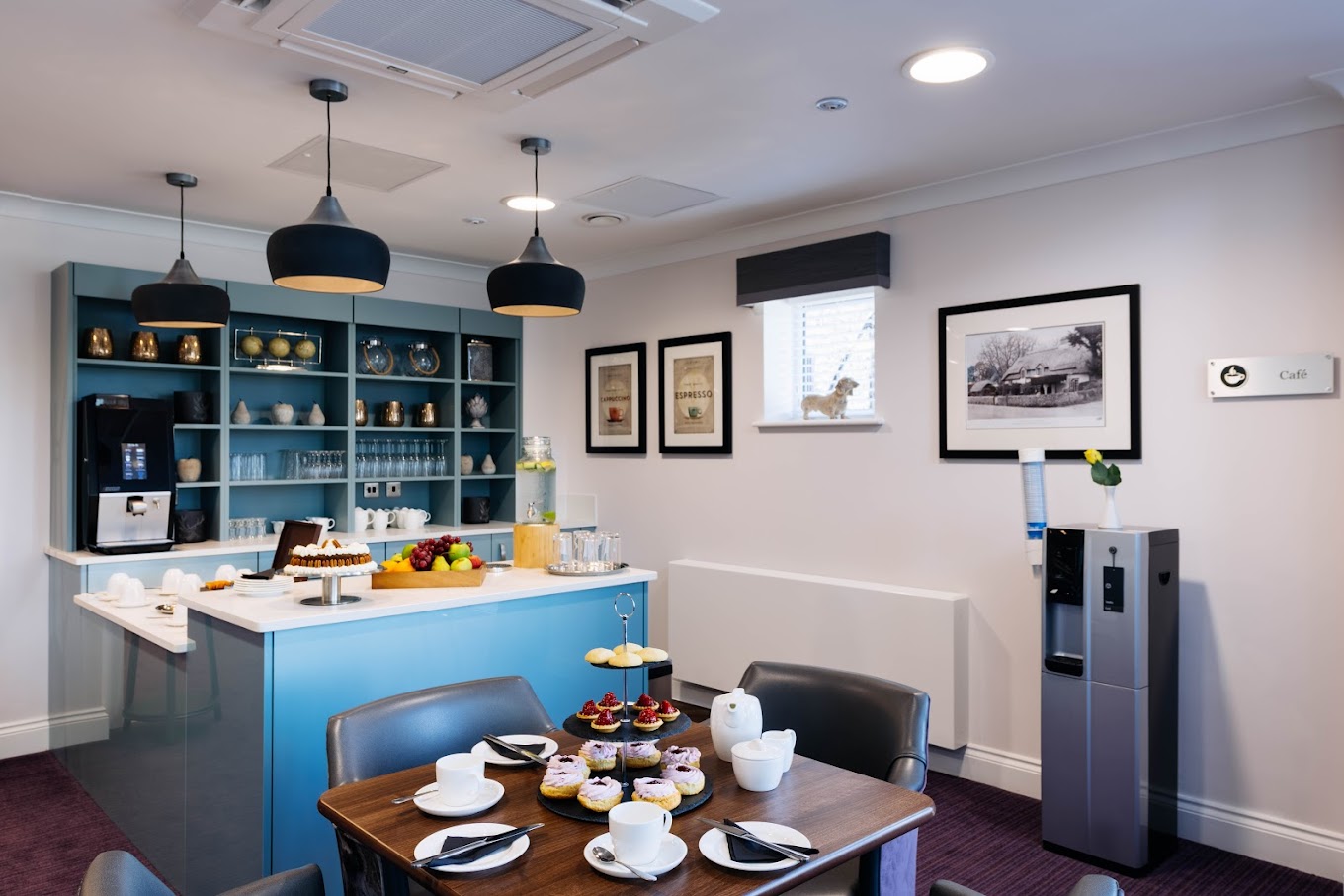 Dining area featuring a well-set table with desserts