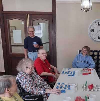 Residents enjoying a game of bingo in the activity room