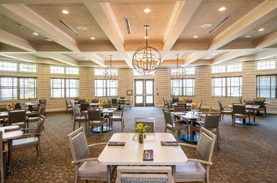 Bright dining room with tables set for meals