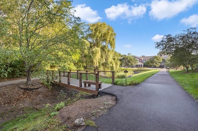 Scenic path with bridge in a senior living community