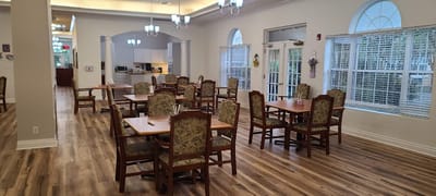 Dining area with tables and chairs for residents