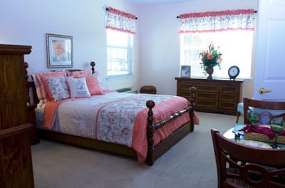 Well-decorated resident bedroom with natural light