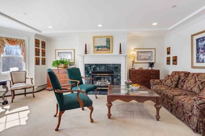 Cozy common area with seating and a fireplace