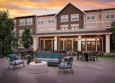 Outdoor seating area with tables and chairs at the facility