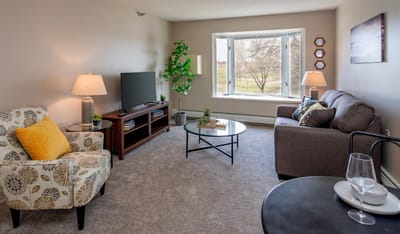 Cozy living room with comfortable furniture and large window