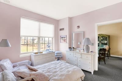 Bright, well-furnished resident room with natural light
