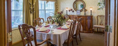 Elegant dining room with a large table set for a meal
