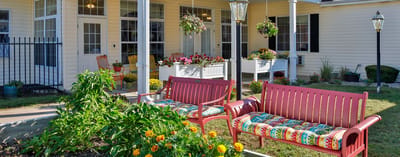 Outdoor space with colorful benches and flower planters