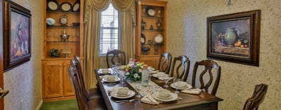 Interior dining room with a set table and decor