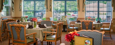 Dining room with tables set for residents