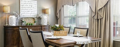 Decorative dining area with table and chairs