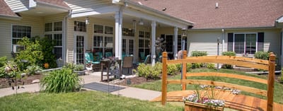 Exterior view of assisted living facility with outdoor space