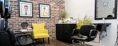 Interior of a hair salon with chairs and decor