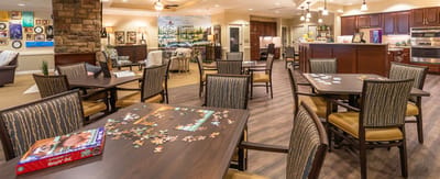 Common area with tables and puzzle activity