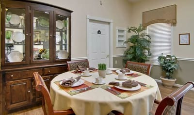 Dining table set for a meal in an interior space