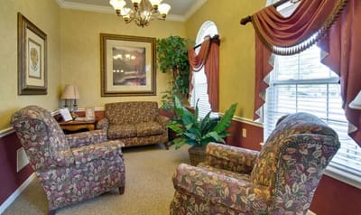Cozy common area with floral furniture and natural light