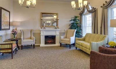 Comfortable lounge area with seating and a fireplace