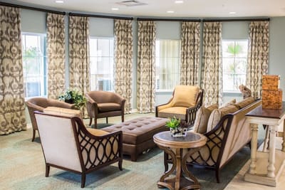 Cozy common area with seating and decorative curtains